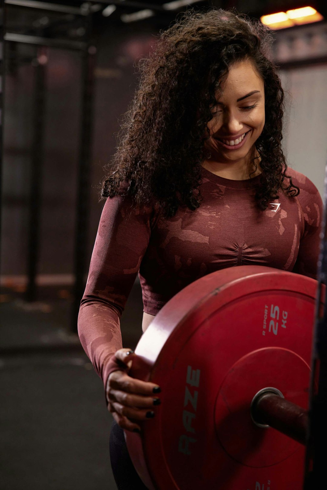 Studio portrait of a belgian woman trainer smiling